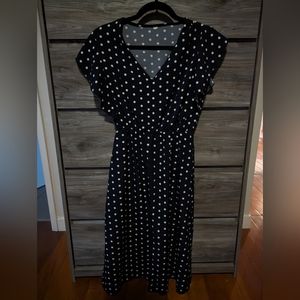 50s-style navy and white polka dot dress